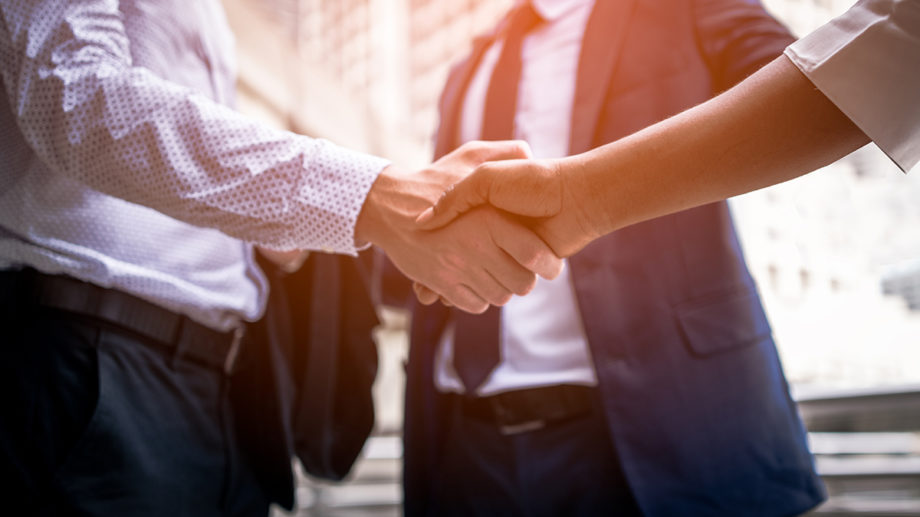 handshake of business People Colleagues Teamwork Meeting .Hold hand and shake hand in city